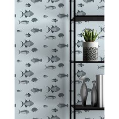 the wallpaper has fish on it and is in black and white with silver accents