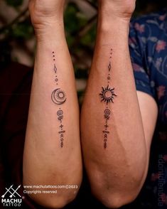 two people with matching tattoos on their arms, both showing sun and moon tattoo designs