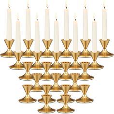 twelve candles are arranged in the shape of pyramids with one candle on each side