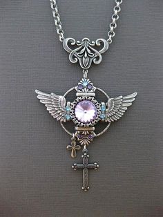 Angel Wings Cross Necklace Listing is for 1 Necklace ☺Wings ☺Fantasy ☺Magical ☺Gothic ~ Pendant Height Approximately 4 inches (see pics for size comparison against American quarter) ~ Wonderfully and Uniquely made with great attention to detail ~ You Choose Your Chain Length (choose during checkout process) ☻ Link To More Wonderful Items: https://www.etsy.com/shop/FashionCrashJewelry?ref=hdr_shop_menu INTERNATIONAL CUSTOMERS, PLEASE REVIEW MY SHIPPING & POLICIES FOR SHIPPING TIMES, AND POSSI Pink Gothic Jewelry, Dragons Breath Fire Opal, Necklace With Cross, Fantasy Necklace, Gothic Pendant, Fantasy Gifts, Necklace Gothic, Fire Opal Necklace, Chic Gowns