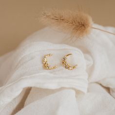 These versatile, celestial earrings embody the magic of the moon. Inspired by the beauty of the night sky with its crescent moon and starry diamond accents, our Eclipse Moon Diamond & Pearl Earrings are an eye-catching pair that will allow you to shimmer from day to night ✨ Material: High Quality Solid 925 Sterling Silver Finish: Sterling Silver ∙ 18K Gold Featuring ~9.5mm x 11mm Crescent Moon & Star Stud Earrings with CZ Diamond and Pearl Gemstones | Sold as a Pair SKU: RR-ER254 Luna Eclipse, Caitlyn Minimalist, Diamond Pearl Earrings, Initial Tag Necklace, Star Celestial, Sideways Initial Necklace, Dainty Initial Necklace, Celestial Earrings, Diamond Huggies