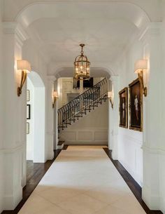 the hallway is clean and ready to be used as an entrance way for someone's home