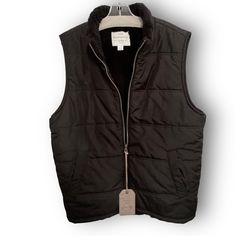 Mens Weatherproof Vintage Black Puffer Vest Size Large Features All Black Puffer Vest With Fleece Lining To Stay Warm In Cooler Months Zip Up Two Front Pockets Stand Up Collar Measurements: 29inch Length 44 Inches Across Black Utility Vest For Winter, Black Vest For Hiking In Fall, Utility Vest For Winter Outdoor Activities, Winter Utility Vest For Outdoor Activities, Utility Vest For Outdoor Winter Activities, Black Winter Vest For Outdoor Work, Black Nylon Outerwear For Outdoor Work, Black Vest For Outdoor Work In Winter, Black Vest For Outdoor Activities In Fall