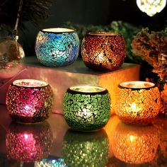 several colorful candles are sitting on a table