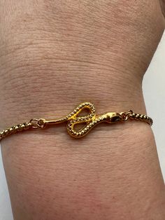 - Gold plated stainless steel  bracelet , the snake is 24K gold plated - Gold snake unisex gold bracelet - The length of bracelet is adjustable up to 28 cm (11 inches) - Colors may appear slightly different on screen due to differences in resolution, brightness, and contrast - Snake necklace available on my shop, follow the link https://www.etsy.com/listing/1608407986/snake-pendant-charm-gold-stainless-steel?ga_order=most_relevant&ga_search_type=all&ga_view_type=gallery&ga_search_query=snake+nec Snake-shaped Metal Bracelets As Gifts, Adjustable Metal Snake-shape Bracelet, Adjustable Gold Snake Chain Bracelet, Adjustable Snake Chain Gold Plated Bracelet, Adjustable Tarnish Resistant Gold Snake Chain Bracelet, Adjustable Gold Plated Snake Chain Bracelet, Adjustable Snake Chain Bracelet As Gift, Adjustable Trendy Snake Jewelry, Trendy Gold Snake Shaped Jewelry