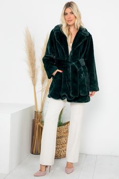 Indulge in luxurious style with our Emerald Green Faux Fur Belted Long Sleeve Coat. The deep emerald green color adds a regal touch while the faux fur and belted waist provide both warmth and a flattering silhouette. Elevate your outerwear game with this premium coat. Regular Size Coat Long Sleeves High Quality Faux Fur Waist Self Belt & Pocket Open Front & Fully Lined Model Size: Height: 5'10 / Bust: 34" / Waist: 24" Model Is Wearing Size: Small Bust: 41" Length: 34" Brand Size Dress Bust Waist