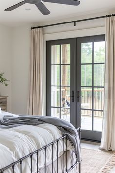 a bedroom with sliding glass doors and a bed