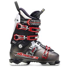 a pair of ski boots with red and black trims on the bottom, sitting in front of a white background