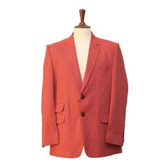 This Chiragh Apparel Blazer Is An Elegant Upgrade On Dapper Tailoring And Features Rich Shades In A Sumptuous Fabric For Elegant Opulence. Fashioned From Premium Quality Cotton, This Striped Blazer Features Full Lining In Japanese Silk, A Notch Lapel, Two-Button Closure And Single-Vented Back. A Left Chest Pocket And Three Flap Pockets Appoint The Front While The Inside Has Two (2) Pockets On The Left And One (1) Pocket On The Right. A Flash Of Contrast Piping Is Added To The Jacket Lining Insid Formal Orange Single Breasted Blazer, Elegant Single Breasted Orange Blazer, Red Festive Semi-formal Blazer, Formal Orange Notch Lapel Outerwear, Formal Orange Outerwear With Notch Lapel, Red Single Button Formal Blazer, Formal Fitted Orange Outerwear, Orange Fitted Formal Outerwear, Red Single-breasted Suits For Spring