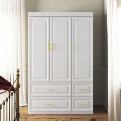 This classic armoire brings a clean, minimalist charm to your bedroom, living room, or home office. Crafted from a combination of solid and engineered wood, it features a white finish and golden handles for a touch of elegance. With three hinged doors and four exterior drawers, it offers ample storage space for your clothes, linens, and essentials. This armoire also includes a clothing rod and three shelves, each with a 15 lbs. weight capacity. A tip-over restraint device is included for added s Bedroom Built Ins, Armoire Dresser, Wardrobe Bed, Corner Wardrobe, Wood Armoire, Daybed Mattress, Small Space Bedroom, Teen Bedroom Furniture, Bedroom Headboard