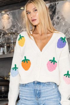 The Strawberry Fields Sweater is the perfect transition from winter to spring. Brighten up your day with this fun and cozy cardigan! Wear open with a tank underneath, or wear closed with layered jewelry! Details: Multi-colored knit strawberries Shoulder patch detail Slightly cropped (easy to tuck in!) Cozy synthetic material #shopkatwalk #springfashion #sweaterweather #cardigan #springsweater Winter To Spring, Von Maur, Jewelry Details, Long Sleeve Knitted Cardigan, Strawberry Fields, Spring Sweater, Slim Fit Top, Cozy Cardigan, Elegant Dresses Long