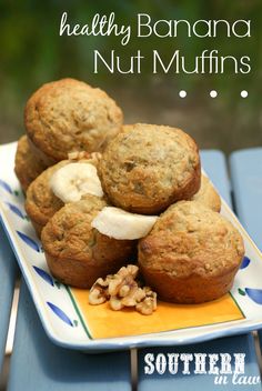 healthy banana nut muffins on a plate with nuts