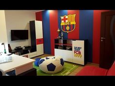 a soccer themed living room with red, white and blue walls