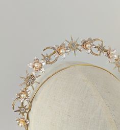 A beautifully whimsical, celestial bridal crown made with pale pink champagne flowers with a rose gold floral centre finished with milky Freshwater pearl. To accompany the florals I've added crystal star and moons to give it that whimsy feel. The halo is lightweight and easy to wear.  The Evermore halo crown. DETAILS * Every order is handcrafted by myself in my small UK based bridal boutique * set onto a comfortable but sturdy headband base, ribbon wrapped at each end for extra comfort. Please d Moon Headpiece, Whimsical Celestial, Champagne Flowers, Bridal Halo, Halo Crown, Delicate Clothes, Floral Halo, Bride Headpiece, Star And Moon