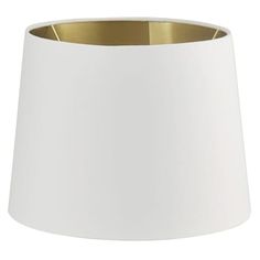 a white lampshade with gold trim on the bottom is shown in front of a white background