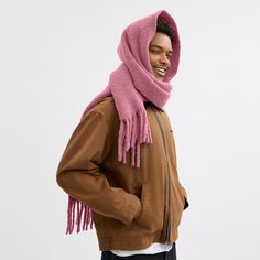 Great for bundling up this warm oversized scarf is the perfect layering piece. The ultra-soft alpaca-blend muffler is finished with long fringe trim and our Coach leather patch in a nod to our heritage craftsmanship. | Coach Oversized Muffler With Leather Patch - True Pink Cozy Fringed Scarves For Fall, Cozy Winter Scarves With Fringe, Casual Winter Scarves With Fringe, Casual Fringe Scarves For Winter, Solid Color Fringe Scarf For Fall, Winter Scarf For Cold Weather, Warm Wool Scarves For Fall, Warm Wool Scarf For Fall, Wool Scarves For Winter