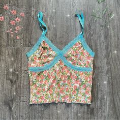 Sweet Floral Crop Top With A Bright Pop Of Blue And Perfect For Summer Brand: Wild Fable Size:Xs Colors: Blue, White, Pink, Green Condition: Never Worn, No Noticeable Flaws Vintage Summer Top With Built-in Bra, Fitted Cotton Camisole With Floral Print, Fitted Floral Print Cotton Camisole, Multicolor Tank Top For Summer Loungewear, Spring Blue Bra-friendly Tank Top, Spring Blue Camisole With Built-in Bra, Summer Multicolor Bra-friendly Tops, Blue Tank Strap Crop Top For Spring, Blue Tank Straps Crop Top For Spring