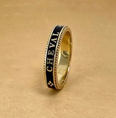 A slim stackable version of our Equus Enamel Ring. Beautiful combination of black enamel and 18 karat yellow gold. 4mm wide Equus (Latin for horse) Cheval (French for horse), stars and a snaffle bit in a continual pattern. Fine beaded detail on both edges. Absolutely gorgeous stacked with the Slim Lace Rein & Diamond Stack rings! Create your own combination! Hand made in the US Made to order, please allow 4-6 weeks for delivery. Enamel Rings, Snaffle Bit, Stack Rings, Diamond Stacks, Mens Rings Fashion, Mens Rings, Rings Fashion, Enamel Ring, Midnight Black