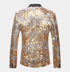 If you are looking for something unique to wear, this stunning silver and gold tuxedo jacket will have all eyes on you the minute you enter the room. Wrap yourself in the luxury of silver velvet and eye-catching gold sequins without emptying your wallet. This unique sequin blazer shows off your sophisticated sense of style and sets you apart from those around you. This single-breasted silver and gold dinner jacket is expertly handcrafted with high-quality velvet and sequins. It is a slim fit gar Black And Gold Tuxedo, Gold Tuxedo Jacket, Floral Suit Jacket, Men's Tuxedo Wedding, Velvet Tuxedo Jacket, Gold Tuxedo, Blazer Wedding, Velvet Tuxedo, Prom Tuxedo