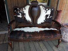 Handmade double chair featuring hair on hide.  This chair also has a press tooled look on the center front and entire back of the chair.  Decorative flowers hand carved top center and center of the seat.  Hide finished with brass tacks. Western Chair, Southwest Furniture, Double Chair, Cowhide Furniture, Rustic Western Decor, Ranch Decor, Wall Art Personalized, Brass Tacks, Western Furniture