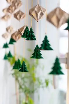 an ornament is hanging from the ceiling next to a vase filled with flowers