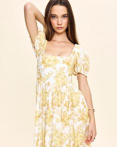 Louise New York creates its collection with the past and present in mind. Inspired by timeless glamour instead of trends, when you slip into a Louise New York dress, you carry all the confidence and carefree attitude that femininity can acclaim. The Chloe Maxi Dress in Yellow Floral boasts a square neckline, slight puffy sleeves and a charming floral print. This lightweight, breezy silhouette grazes the floor and flows effortlessly. Product Details Cotton. Made in NYC. Care Instructions Dry-clea Timeless Glamour, New York Dress, Lela Rose, Column Dress, York Dress, Past And Present, Puffy Sleeves, Rose Print, Yellow Floral