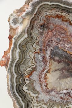 Crazy Lace Agate SlabApprox. Dimensions: 4 x 4 x 0.25 inchesApprox. Weight: 137 gramsLocality: Mexico Acrylic slab stand is included. This lovely cross-section of a crazy lace agate nodule displays the intricate banding that Mexican lace agate is best known for. This slab has a high polish on the front and is unpolished on the reverse. Crazy lace agate is a variety of agate known for its vibrant and intricate banding patterns, often resembling chaotic and whimsical designs. Originating mainly fr Mexican Lace, Agate Rocks, Skull Carving, Crystal Decor, Crystal Skull, Polish Jewelry