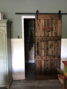 36x84 Wood Barn Door - Barn door is finished in dark walnut and wax sealed.  Embellished with iron clavos (nail heads) add character.  Red decor and front pull on door NOT included. Barn Door Farmhouse, Pintu Interior, Interior Boho, Custom Barn Doors, Wood Barn Door, Barn Door Designs, Rustic Barn Door, Shutters Exterior