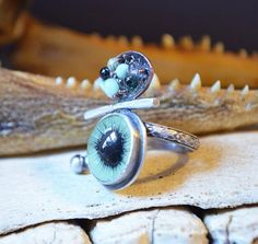 a close up of a ring with an eye on it