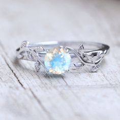 Natural Rainbow Moonstone Engagement Ring Solid 14k White Gold Inspired Moonstone Leaf Ring Bridal Jewelry Everyday Wear Jewelry Gift Ring ≫ Features * SKU : SKU-0054 * Gemstone : 100% Rainbow Moonstone  * Gemstone Weight : 1.00 cts * Gemstone Color : Blue  * Gemstone Quality : AAA * 14K Solid White Gold, ( Available in 14K & 18K Yellow, Rose, and White Gold ) * Option available in 18K Gold * All size available * Ready to Ship in 1-2 Weeks ≫ FAQ below for more detail. ✦ Sizing We can adjust most items to fit your sizing preferences. Most items can be made to any size and length. Please leave a note at checkout or contact us via Etsy conversation. Even after purchasing the item, you can still ask us to adjust the size or length. We will try our best to fix it if it is possible. ★ Rings also Rainbow Moonstone Engagement Ring, Jewelry Everyday, Everyday Wear Jewelry, Sweet Ring, Moonstone Engagement, Moonstone Engagement Ring, Leaf Ring, Natural Rainbow, Gift Ring