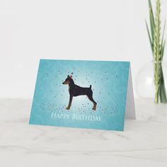 a blue birthday card with a dog on it