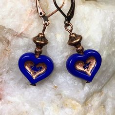 Royal blue Czech glass heart beads with copper inlays dangle from copper beads. These heart earrings are very versatile, lightweight and comfortable for all day wear.  Design is on both sides of the 3-D heart charm. Artisan glass beads produced in small quantities in Czech Republic  Hypoallergenic ear wires (nickel and lead free). Select ear wire style at checkout. A gift for you or someone special, earrings are carded and in an organza bag. Link back to my shop: https://www.etsy.com/shop/JezaJewelry Royal Blue Heart Czech Glass Earrings  - Bohemian Jewelry -  Handmade Gift for Her - Valentine's Day Gift Royal Blue Heart, Prom Jewelry Earrings, Blue Heart Earrings, Necklaces Boho, Summer Blues, Winter Earrings, Boho Chic Jewelry, Handmade Gifts For Her, Heart Dangle Earrings