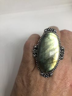 Huge blue green Labradorite rainbow moonstone Lovely vintage silver setting is low content silver Size 7.5 Can be re sized for you for $10-$20 jeweler's fee About an inch long Ring is long covers from knuckle to knuckle. All rings are shipped free in the US in a nice gift box. Check out our over a THOUSAND great reviews Engraving is $4 per letter and is not always perfect depending on the piece. It can take a few days if the jeweler is busy. This is payable to Paypal Judithsltd@gmail.com Vintage Silver Moonstone Ring With Large Stone, Vintage Large Moonstone Ring In Sterling Silver, Antique Silver Moonstone Ring, Vintage Oval Labradorite Jewelry, Bohemian Oval Labradorite Jewelry, Vintage Labradorite Gemstone Rings, Handmade Antique Oval Moonstone Ring, Antique Oval Moonstone Ring Handmade, Artisan Silver Moonstone Ring