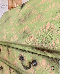 an old green and pink painted dresser with handles