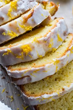 slices of lemon pound cake with icing and orange zest