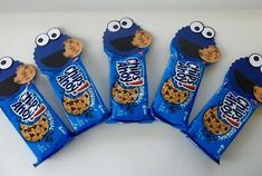 five cookies with eyes and ears are in the shape of cookie monster