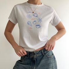 90s Inspired Cotton T-shirt With Custom Print, 90s Inspired Short Sleeve Tops With Custom Print, 90s Inspired Custom Print Short Sleeve Tops, 90s Inspired Crew Neck Top With Custom Print, Y2k T-shirt With Custom Print In Relaxed Fit, Unisex White Graphic Tops, Unisex White Graphic Design Top, White Graphic Design Unisex Tops, White Y2k Tops With Screen Print