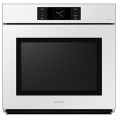 a white oven with a clock on the front and side panel in stainless steel, against a white background