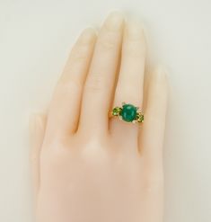 White & Canary Diamond Ring, Yellow Diamonds, Genuine Emerald Ring, Estate Ring, 18K Gold, Ring, Italian Ring, Genuine Diamonds, This gorgeous vintage ring is finely crafted in solid 18K Yellow Gold, made in Italy. The center Natural Emerald cabochon is 11x9mm (3.75 carats). This gem has some minor signs of wear which cannot be seen without magnification. Two natural fancy canary Diamonds are .45 carat each = .90 carat for two gems. Four small white bezel set diamonds total .12 carat; they a Green Multi-stone Diamond Ring For Formal Occasions, Exquisite Green Ring For Anniversary, Formal Green Multi-stone Diamond Ring, Classic Green Multi-stone Diamond Ring, Heirloom Style Three Stone Green Emerald Ring, Heirloom Green Emerald Ring With Three Stones, Elegant Green Gemstones In 14k Gold, Luxury Green Cluster Ring For Anniversary, Collectible Green Multi-stone Jewelry