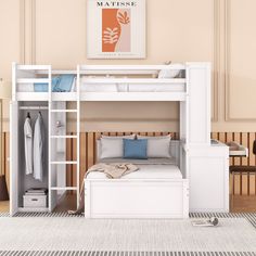 a white bunk bed sitting next to a dresser