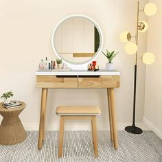 a vanity table with a mirror and stool next to it in a room that has a rug on the floor