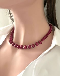 Gorgeous Chunky Red Jade Necklace in 14K Goldfilled .Matching Earrings included . The Deep red definitely makes it a a style statement !  Very Similar to a Faceted Ruby necklace ! Graduated Red Jade Beads : Goldfilled Lobster Clasp Red Jade Beads : 8 - 12 mm Necklace length : 18 inches + 1.00 inches Jade has long been considered to be a lucky stone, especially by the peoples of Southeast Asia. The spiritual meaning of Jade is longevity and wisdom. It is believed to facilitate access to the spiritual realms, provide protection against negative energies and entities, and also to enhance our creativity and imagination Red Hypoallergenic Jewelry For Party, Hypoallergenic Red Jewelry For Parties, Hypoallergenic Red Round Jewelry, Red Hypoallergenic Party Jewelry, Red Jewelry For Christmas Gift, Red Jewelry Christmas Gift, Red Christmas Jewelry Gift, Red Necklace For Christmas Anniversary, Red Single Strand Jewelry For Party