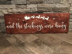 a wooden sign that says and the stockings won't bring with santa on his sleigh