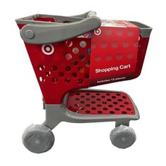 a shopping cart with two wheels and a red basket on the front, sitting upright against a white background