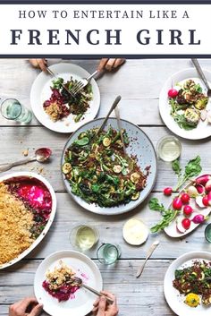 several people sitting at a table full of food