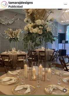 there is a table set with candles and flowers in the center, along with other place settings