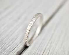 Unique, hammered solid sterling silver ring. looks equally good on its own or worn with others as a stacking ring! It is made from sterling silver wire, and has been hammered with a straight-edge hammer, and has its inside edge smoothed for a comfortable fit. This ring is 2mm wide, and is perfect for wearing everyday. It will arrive in a branded pouch, great for gift giving to yourself or a loved one. Designed and made from scratch by me in my Mount Hawthorn jewellery studio in Australia.  Thank Jewellery Studio, Hammered Silver Ring, Jewellery Silver, Silver Stacking Rings, Sterling Silver Jewellery, Jewelry Studio, Silver Rings Handmade, Straight Edge, Hammered Silver