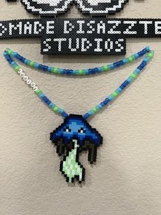 Trippy blue mushie perler necklace! Can be customized to any color way! Fun Blue Necklace For Gift, Fun Handmade Blue Jewelry, Playful Blue Beaded Necklaces For Gifts, Playful Blue Beaded Necklace For Gift, Fun Blue Handmade Necklaces, Playful Handmade Blue Beaded Necklaces, Handmade Whimsical Blue Beaded Necklaces, Whimsical Handmade Blue Beaded Necklaces, Playful Blue Beaded Necklace Gift