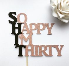 there is a cake topper that says so happy m'thry on it