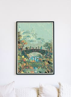 a painting hanging on the wall above a bed in a room with white walls and pillows